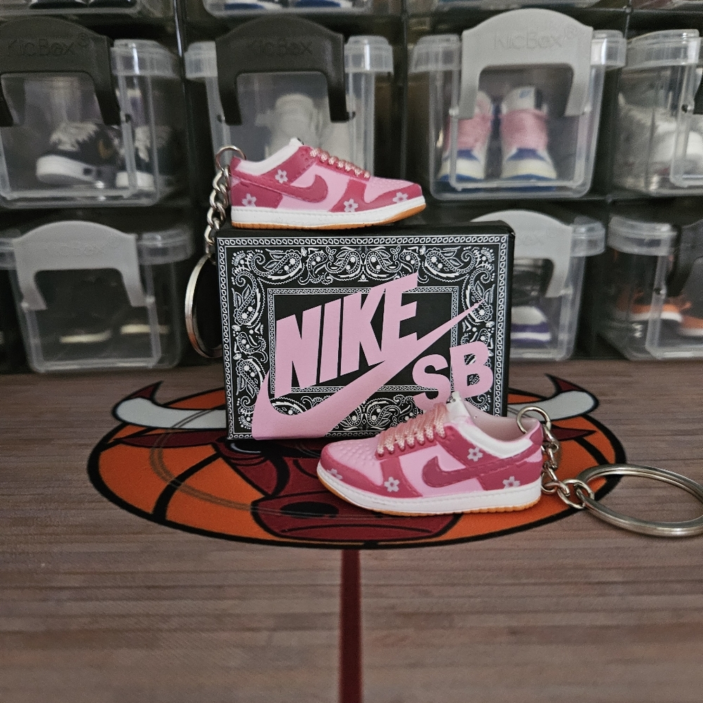 Nike SB pair of mini sneakers keychain.